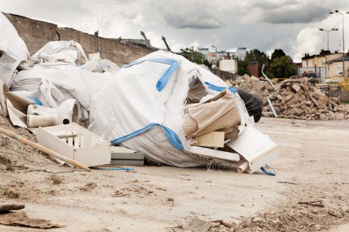 Construction site with builders waste being cleared