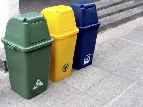 Technician managing waste sorting at a local facility