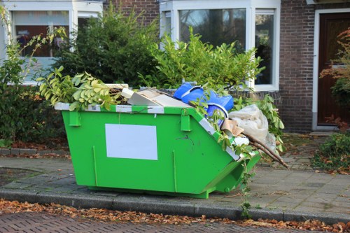Borough recycling bins and separated materials at a neighbourhood collection point